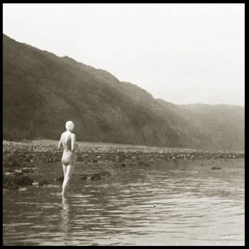 Photographs by Mary Stella Edwards of a woman in a bathing suit standing at the edge of the sea