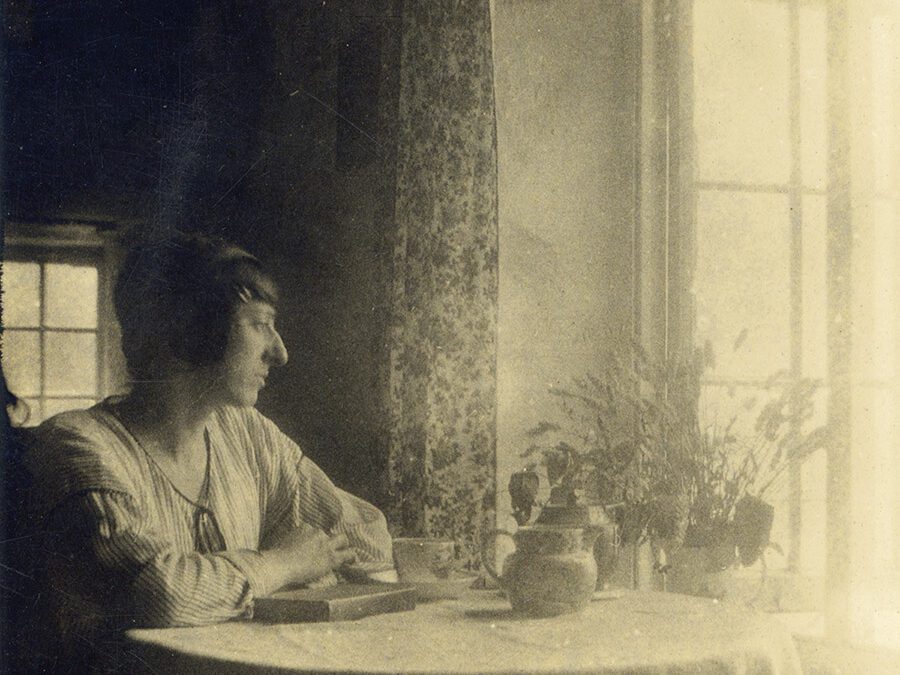 Judith Ackland sitting at the table in The Cabin