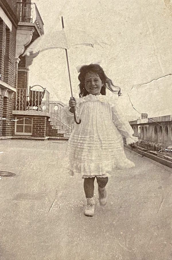 Small child with sunshade in early 1900s